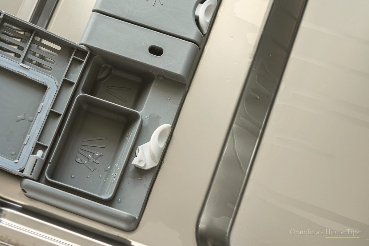Close-up of the dishwasher detergent dispenser on the door