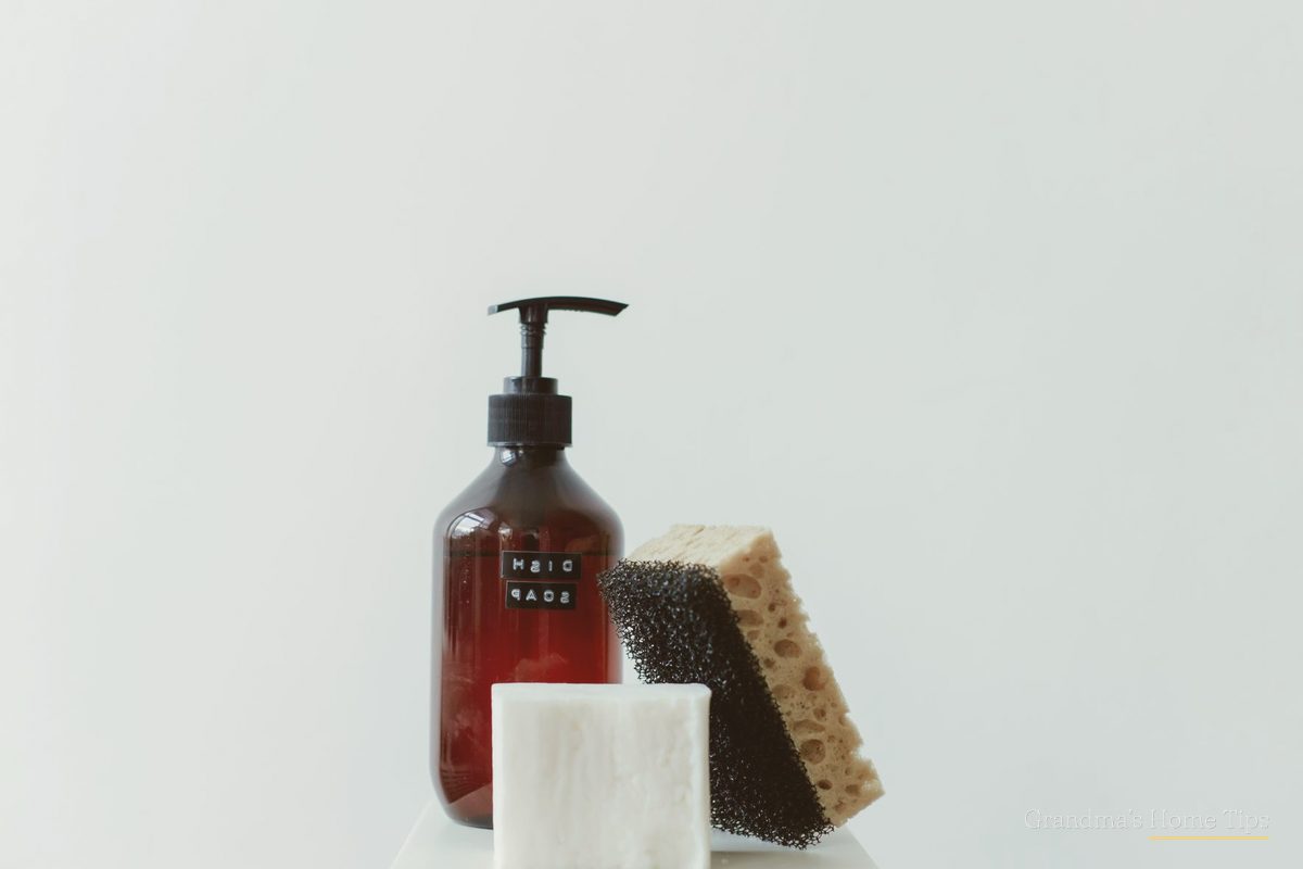 Dish soap and sponge ready for stain treating
