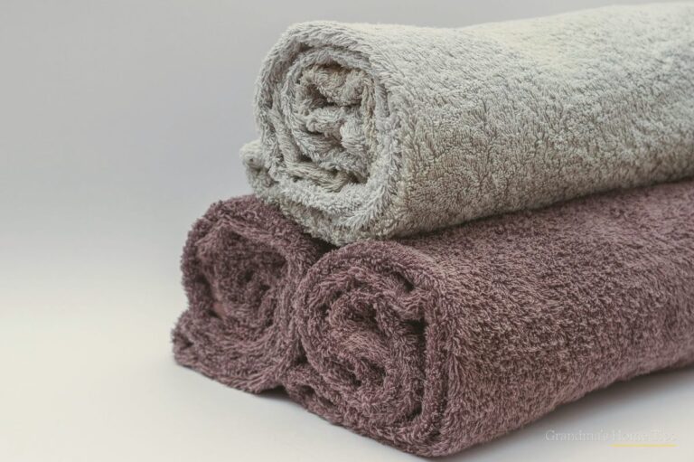 Soft rolled towels in neutral tones after a vinegar rinse