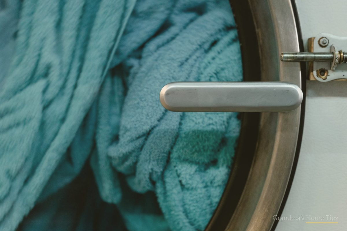 Washing machine door with fresh towels inside